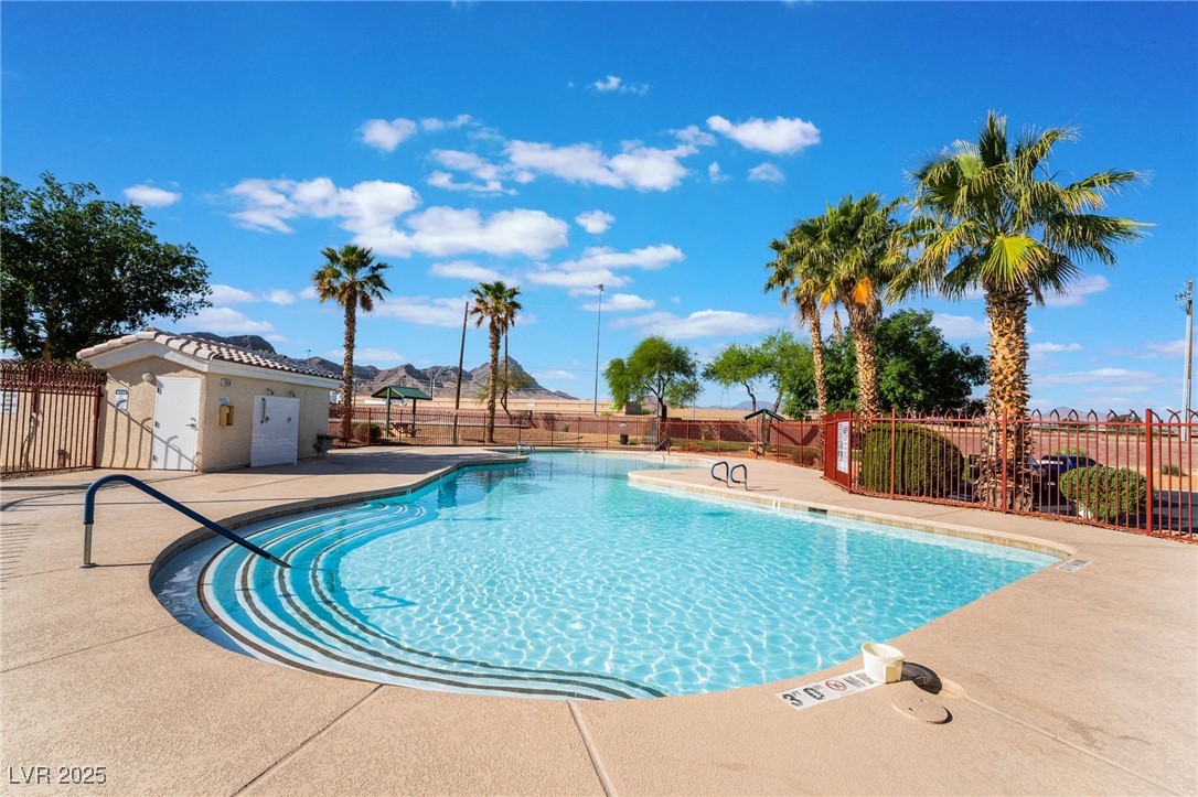 1570 Rusty Ridge Lane Henderson, NV 89002 - Photo 35 of 35 Community pool with a patio area and fence