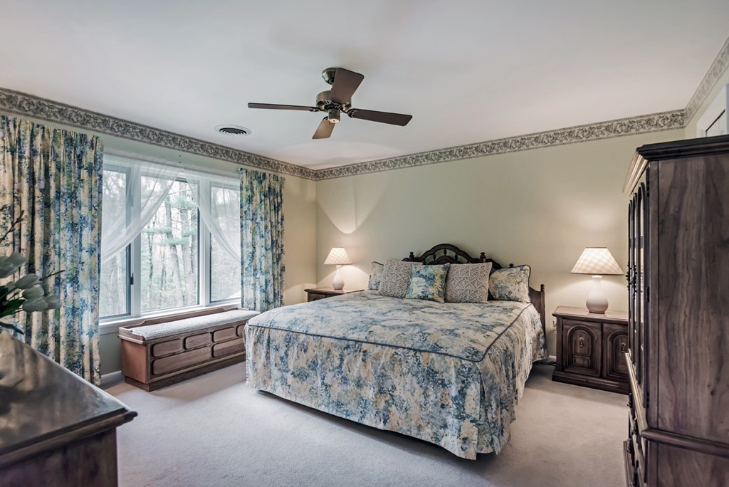 10 Regis Road Andover, MA 01810 - Photo 16 of 30 a bedroom with a bed and a large window