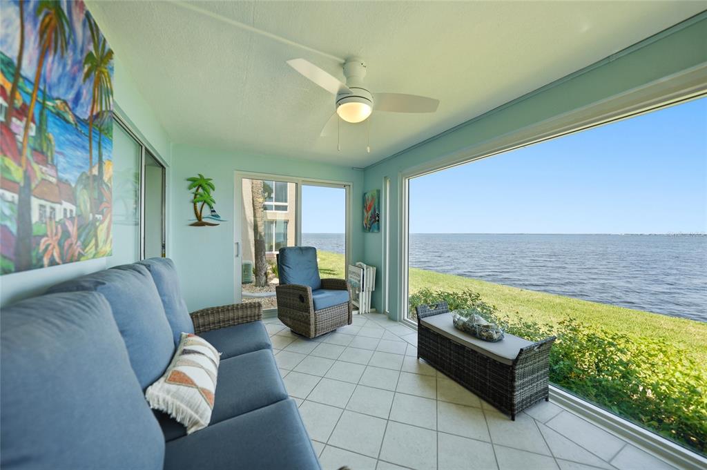1 Colony Point Drive, Unit A10 Punta Gorda, FL 33950 - Photo 28 of 31 a living room with furniture and a swimming pool