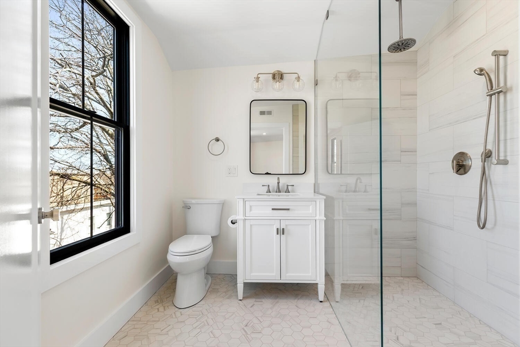 300 West 3rd Street, Unit 300 Boston, MA 02127 - Photo 15 of 23 a bathroom with a toilet sink and shower