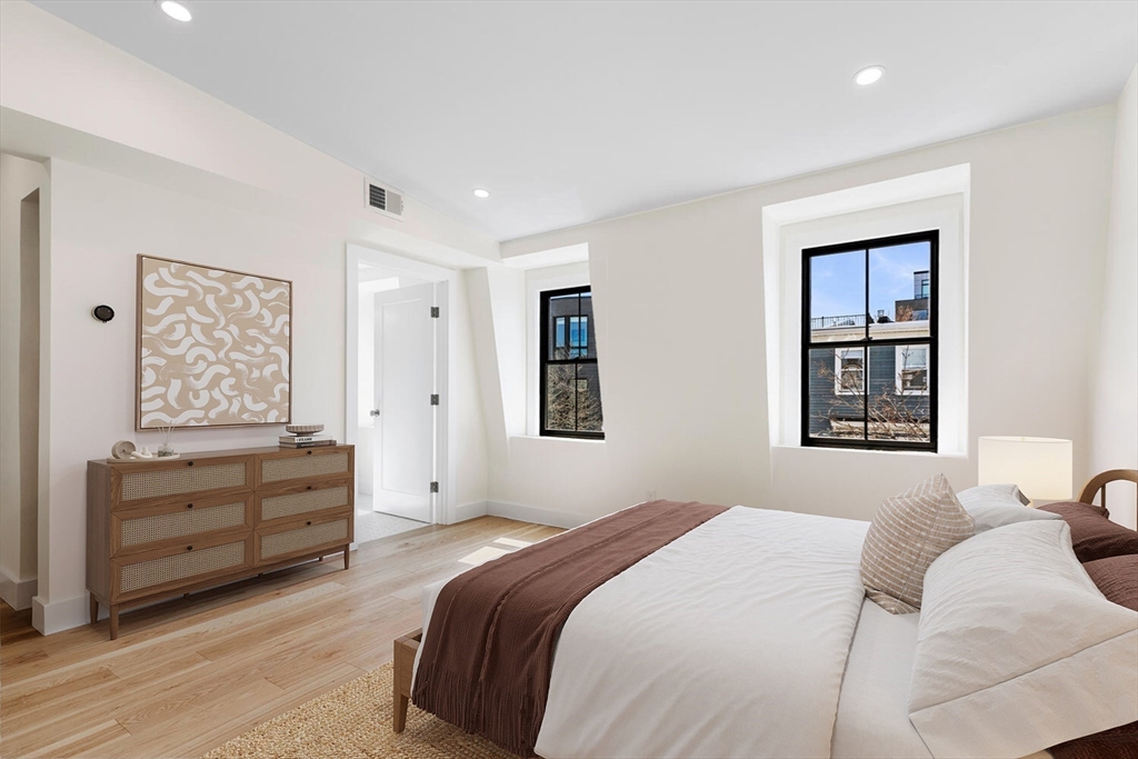 300 West 3rd Street, Unit 300 Boston, MA 02127 - Photo 16 of 23 a bedroom with a bed and a window
