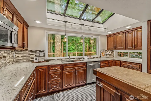 a kitchen with a sink stove and cabinets