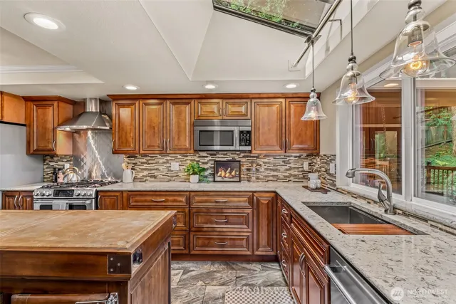 a kitchen with a sink stove and cabinets