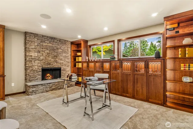 a living room with furniture a window and a fireplace