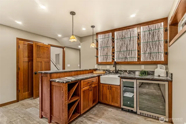 a kitchen with a stove and a sink