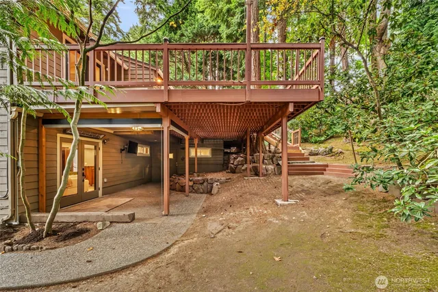 a view of a house with a wooden deck