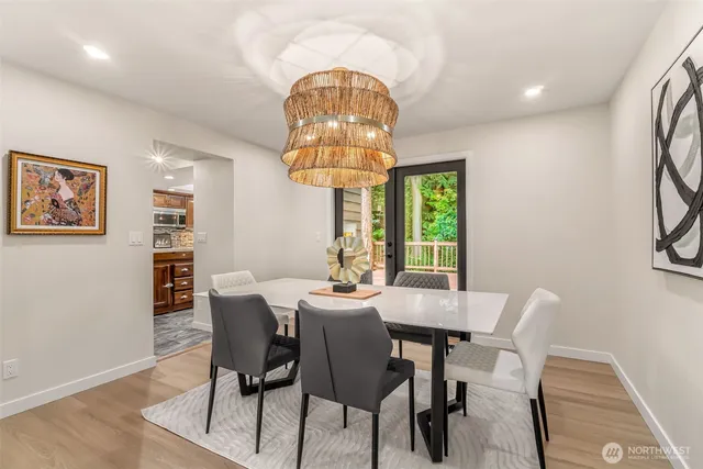 a view of a dining room with furniture window and wooden floor