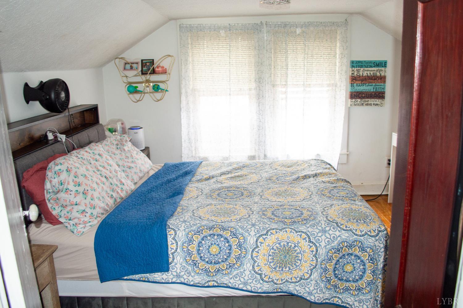 400 Prospect Road Hurt, VA 24563 - Photo 13 of 17 a bedroom with a bed and wooden floor