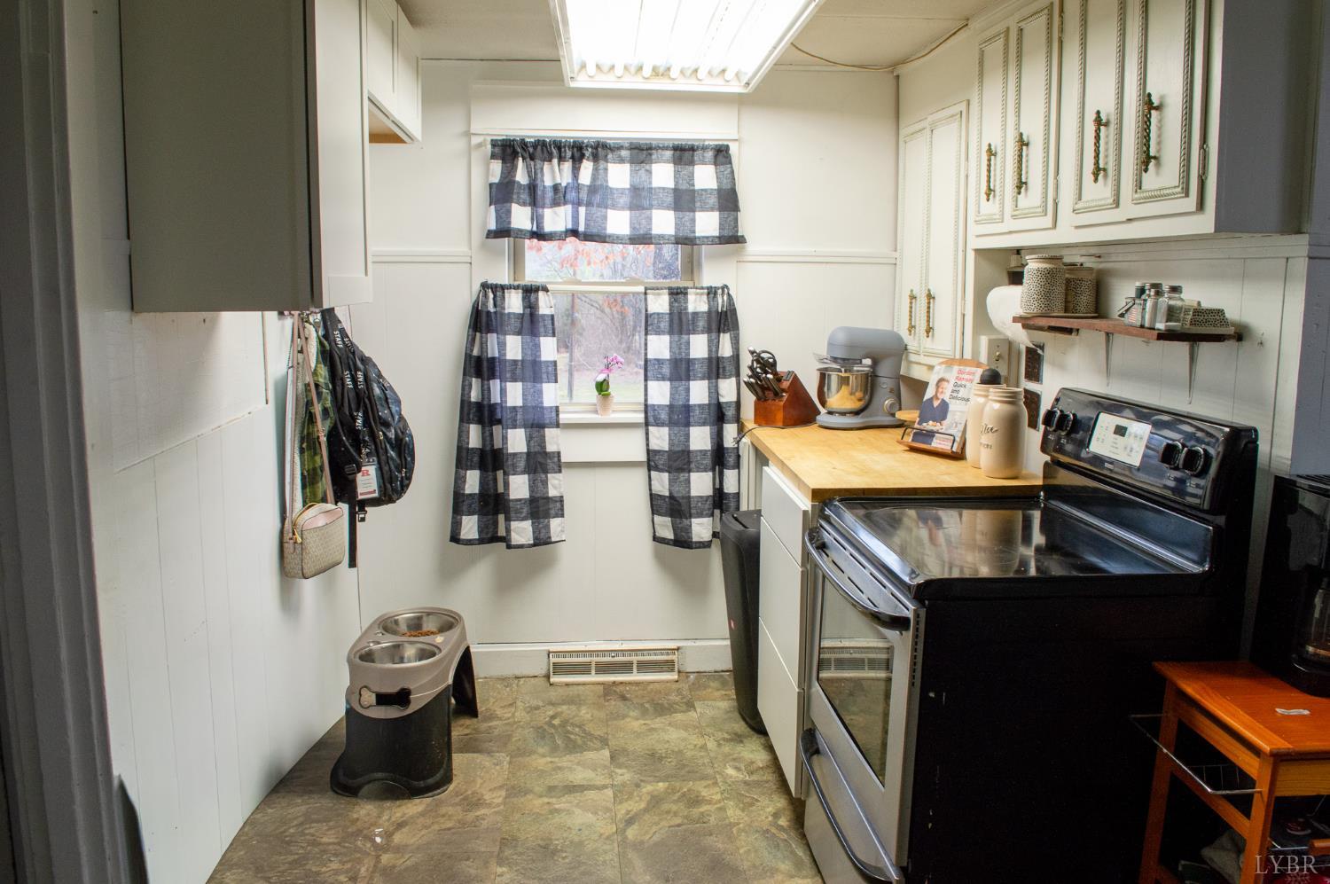 400 Prospect Road Hurt, VA 24563 - Photo 8 of 17 a kitchen with a sink and cabinets