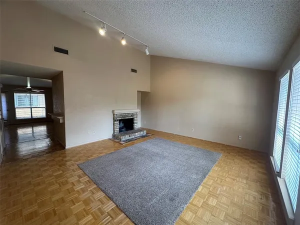 a view of empty room with fireplace