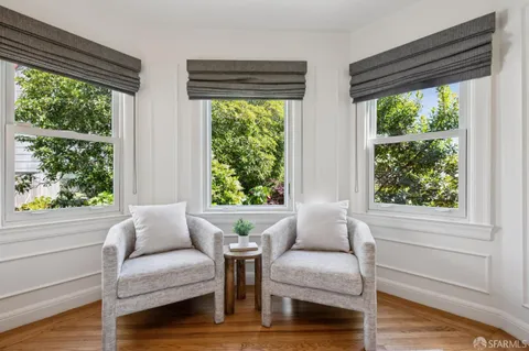 a bedroom with furniture and a window