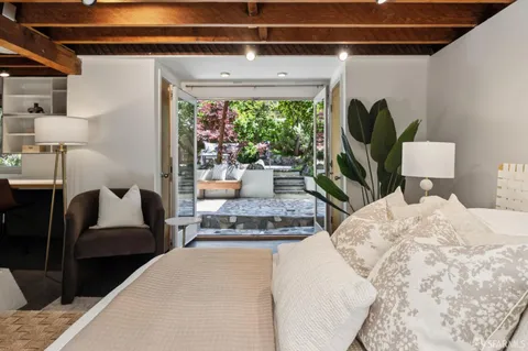 a bed room with a bed and a chandelier