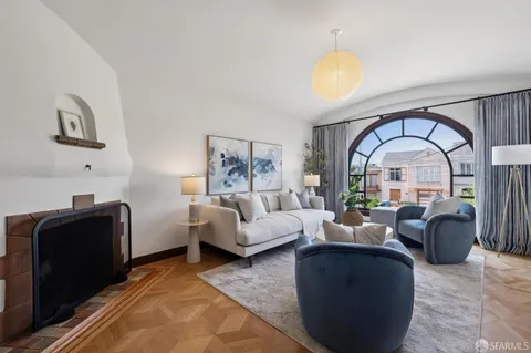 a living room with furniture rug and window