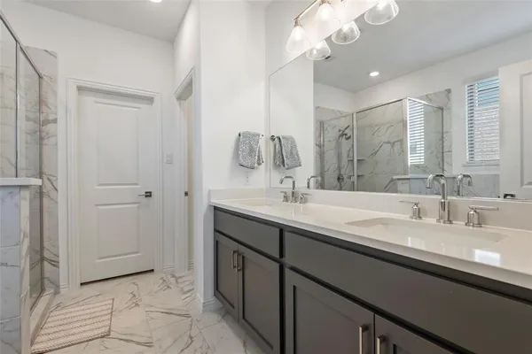 a bathroom with a sink a vanity and a mirror