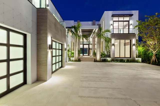 a living room with fireplace furniture and a large window
