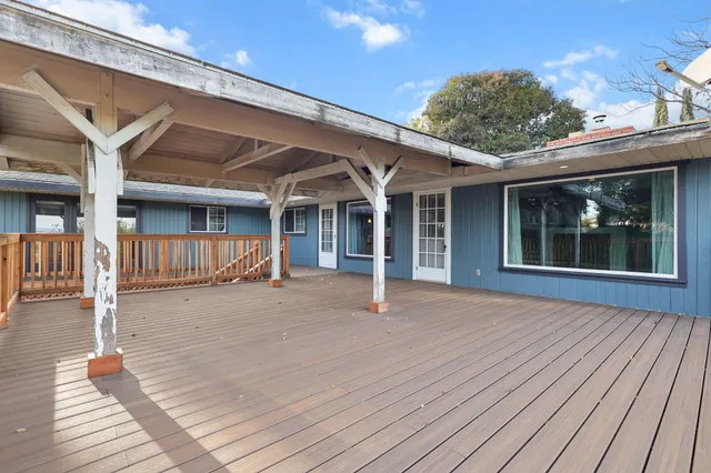 a view of a house with pool table and chairs