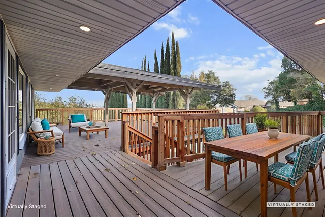 a view of a chairs on wooden deck