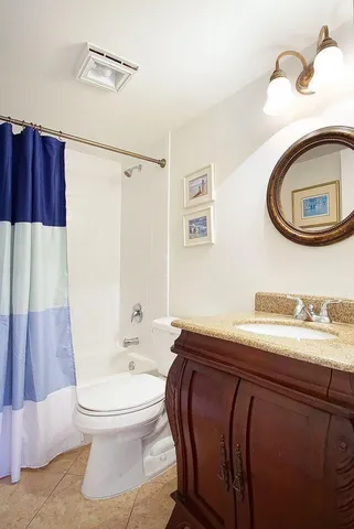 a view of a balcony with chair and table