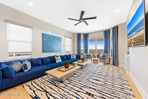 a hallway with wooden floor and furniture
