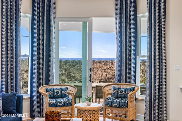 a bathroom with a double vanity sink mirror and shower