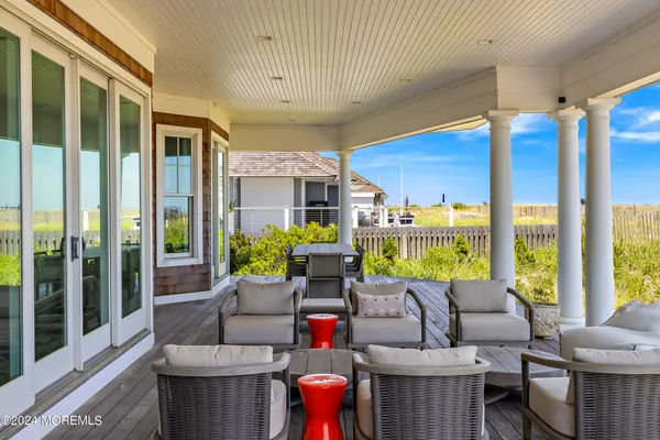 a white bath tub sitting next to a white toilet