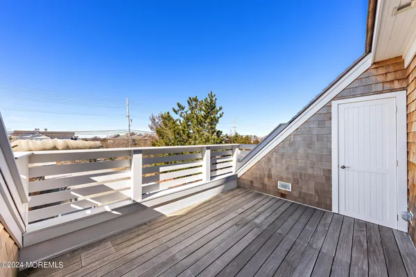 a bathroom with a sink vanity mirror and toilet