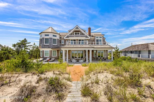 a living room with furniture a fireplace and a table