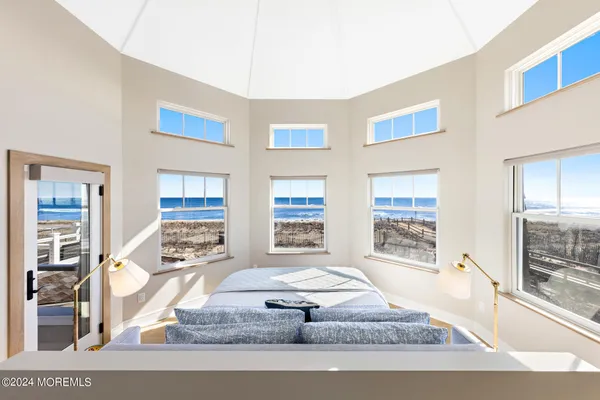 a bedroom with a bed and a night stand