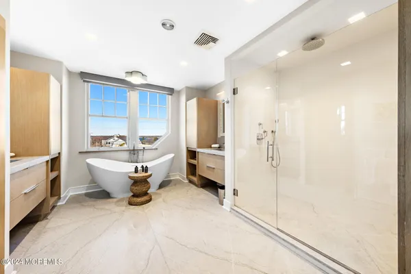 a front view of a house with swimming pool and outdoor seating