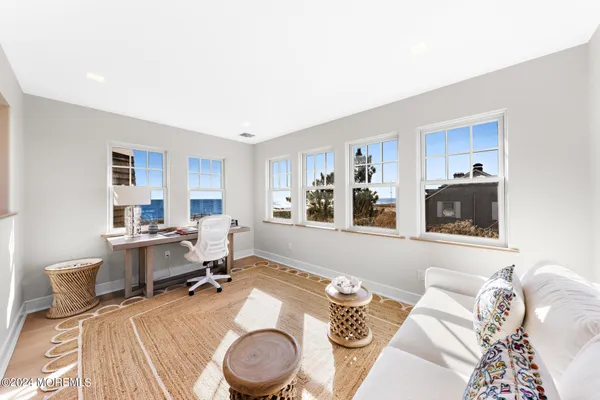 an aerial view of a house with a big yard and large trees
