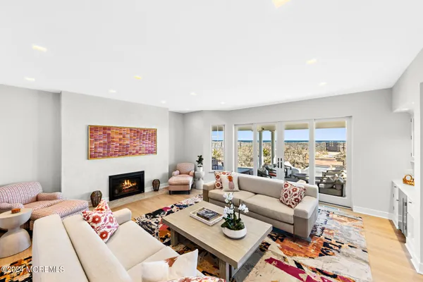 a living room with furniture fireplace and a table