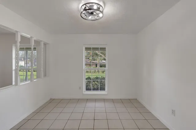 a view of a bathroom with a sink and a mirror