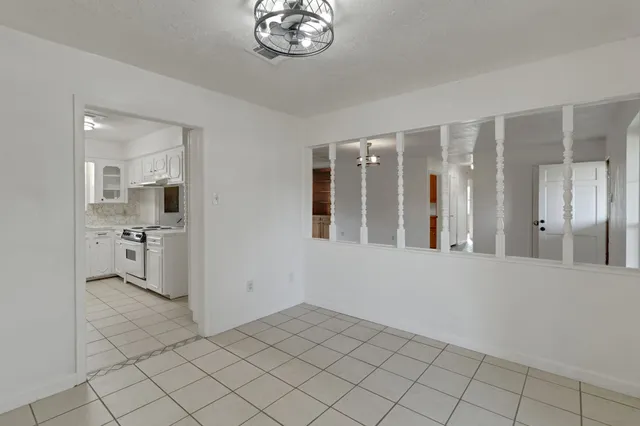 a kitchen with stainless steel appliances granite countertop a stove and a refrigerator