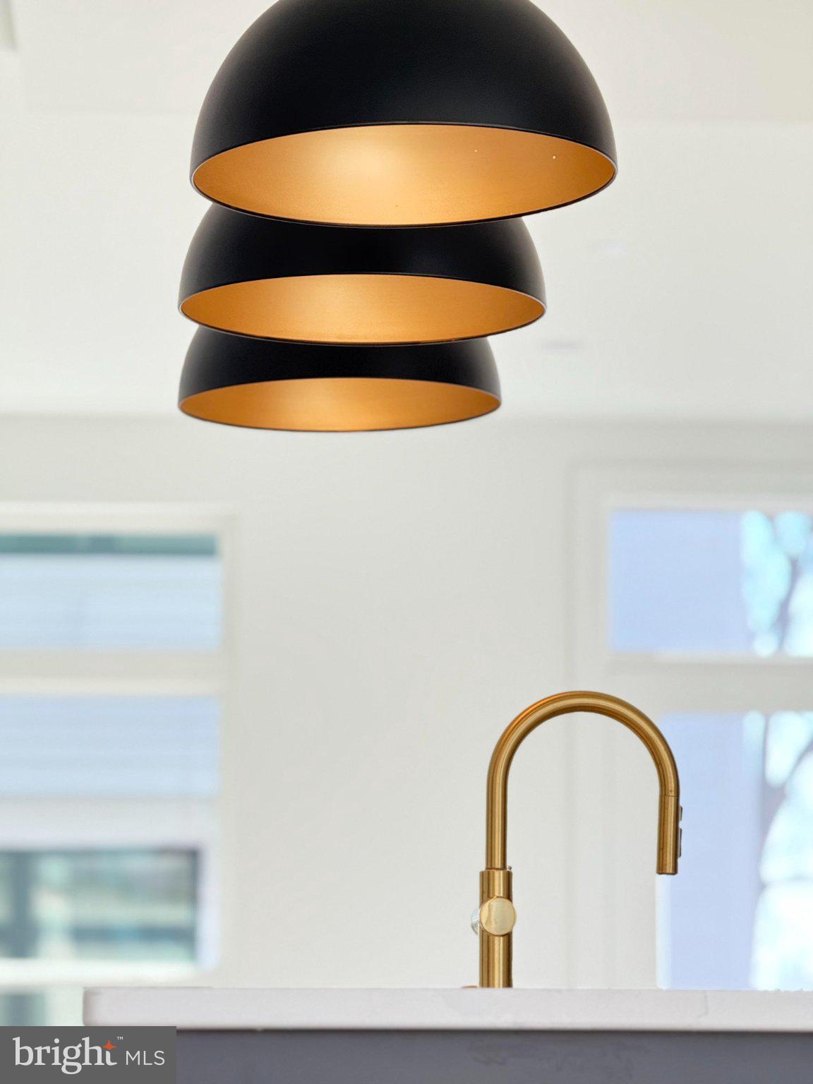 2106 Tysons Ridgeline Road Falls Church, VA 22043 - Photo 10 of 40 Sleek pendant lights illuminate elegance.