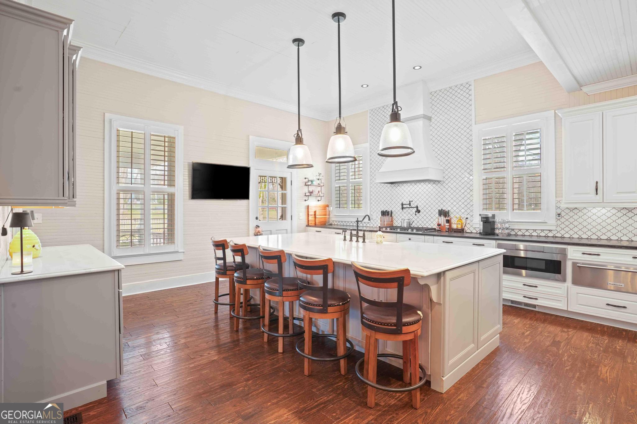 193 Bartee Road Woodbury, GA 30293 - Photo 22 of 84 a large kitchen with a table and chairs