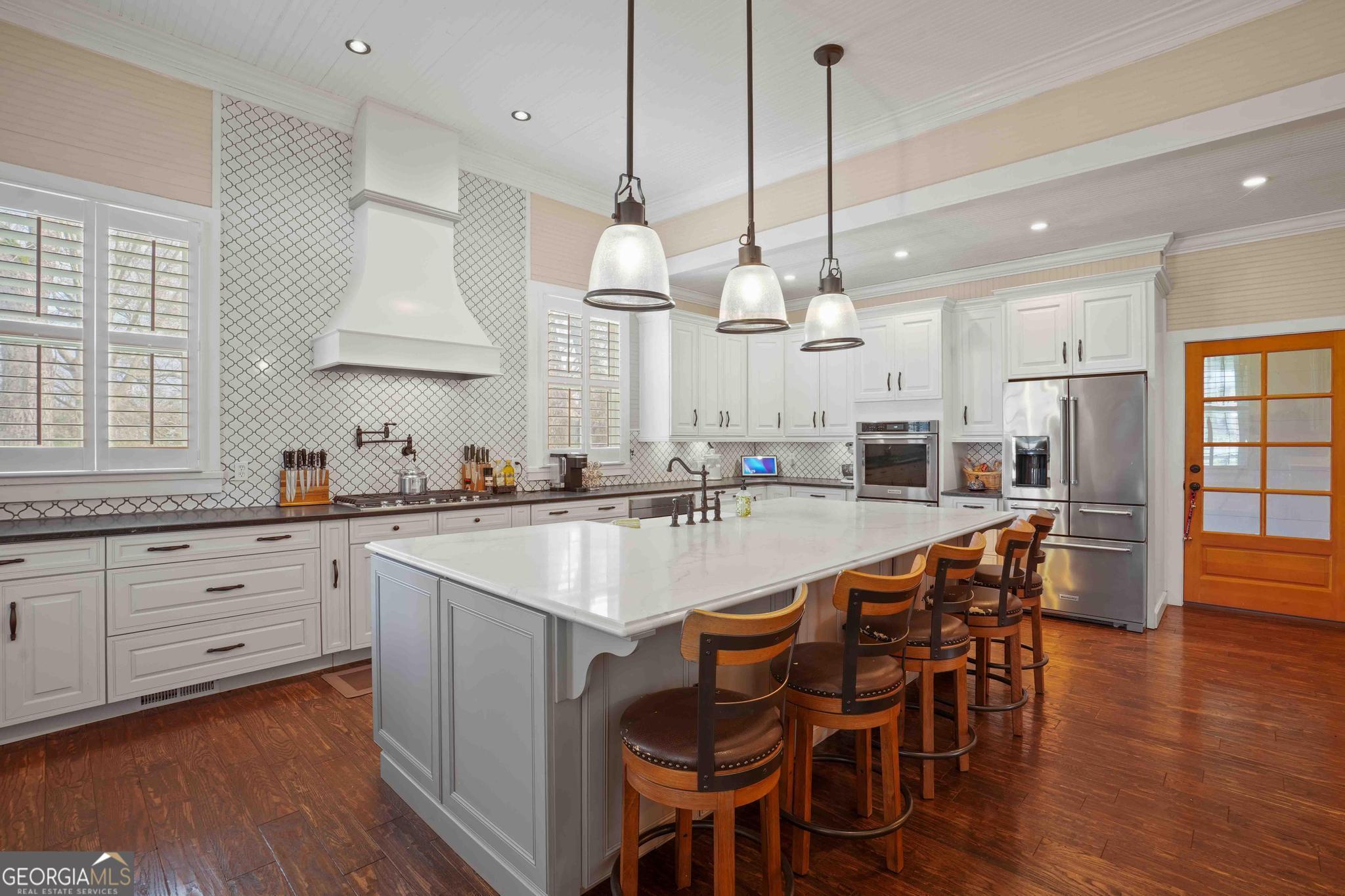 193 Bartee Road Woodbury, GA 30293 - Photo 23 of 84 a large kitchen with a table and chairs