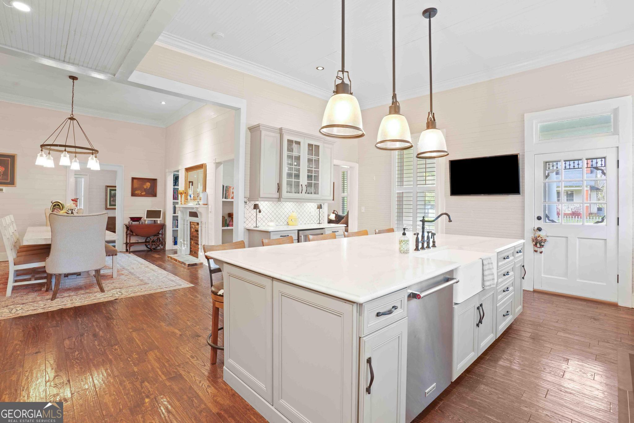 193 Bartee Road Woodbury, GA 30293 - Photo 25 of 84 a large white kitchen with a large island oven a stove and a sink