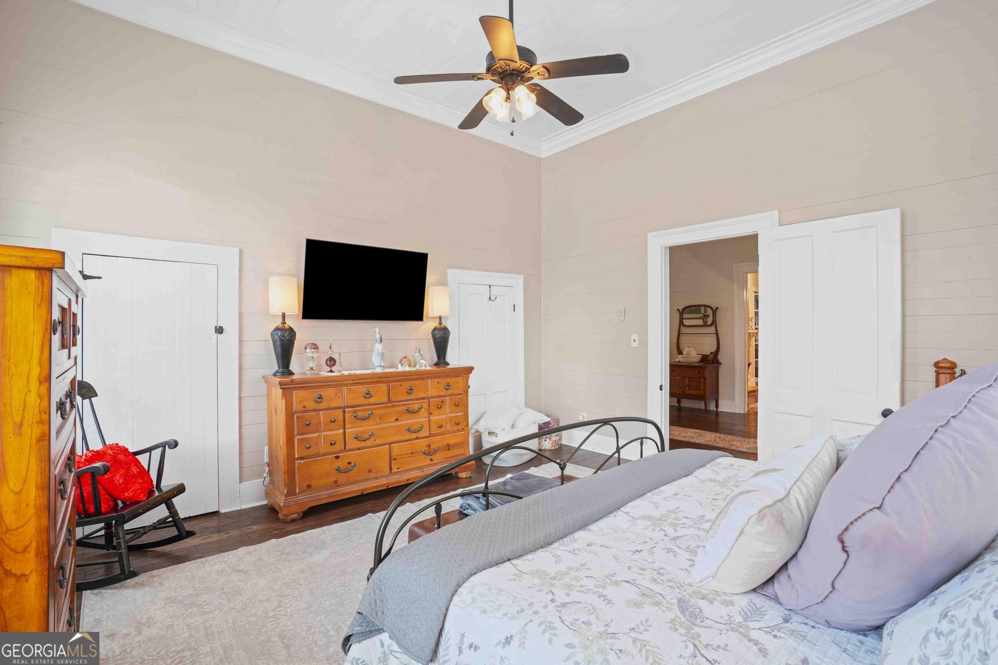 193 Bartee Road Woodbury, GA 30293 - Photo 35 of 84 a bedroom with a bed and flat screen tv