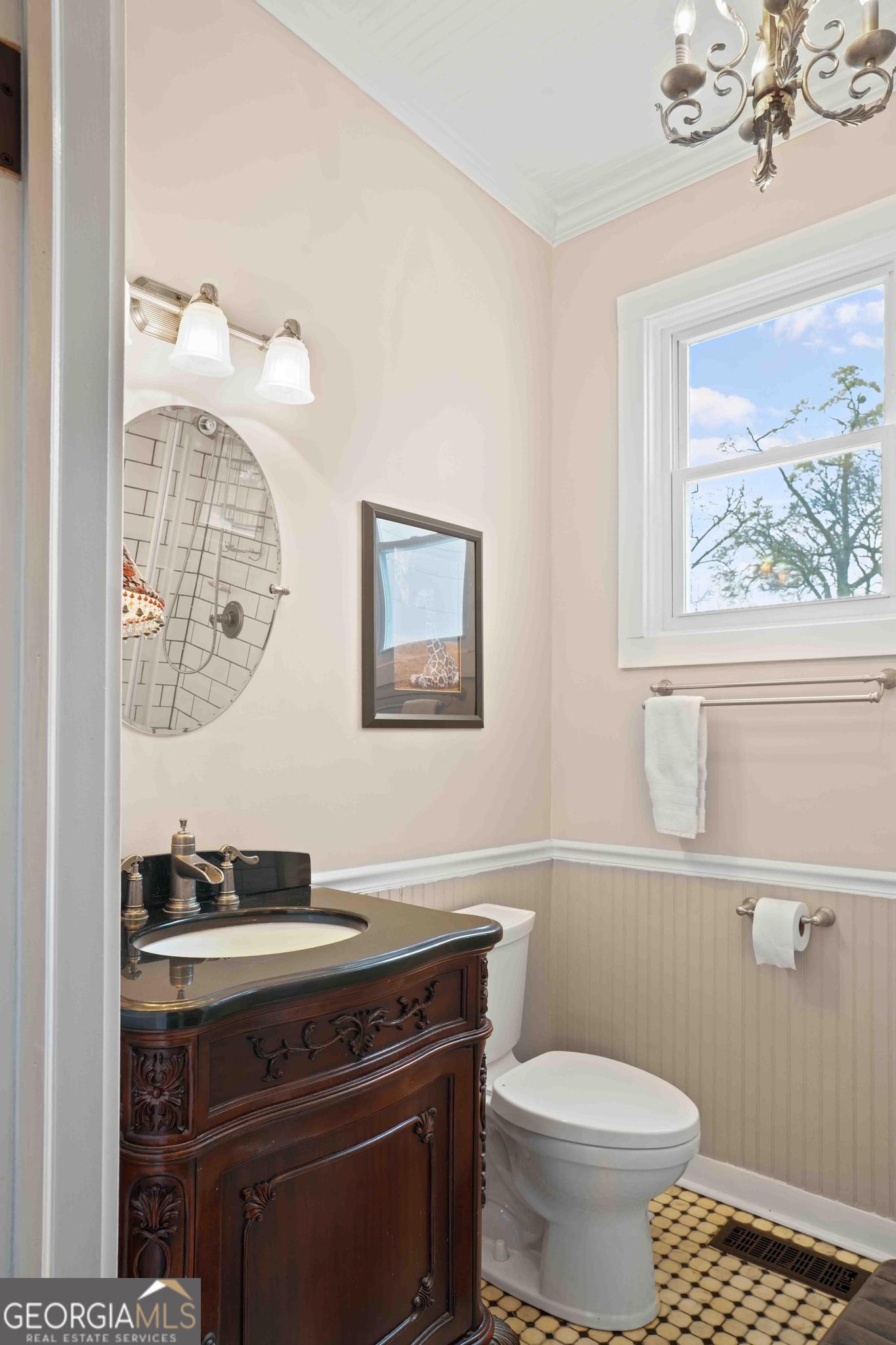 193 Bartee Road Woodbury, GA 30293 - Photo 38 of 84 a bathroom with a toilet a sink and a mirror