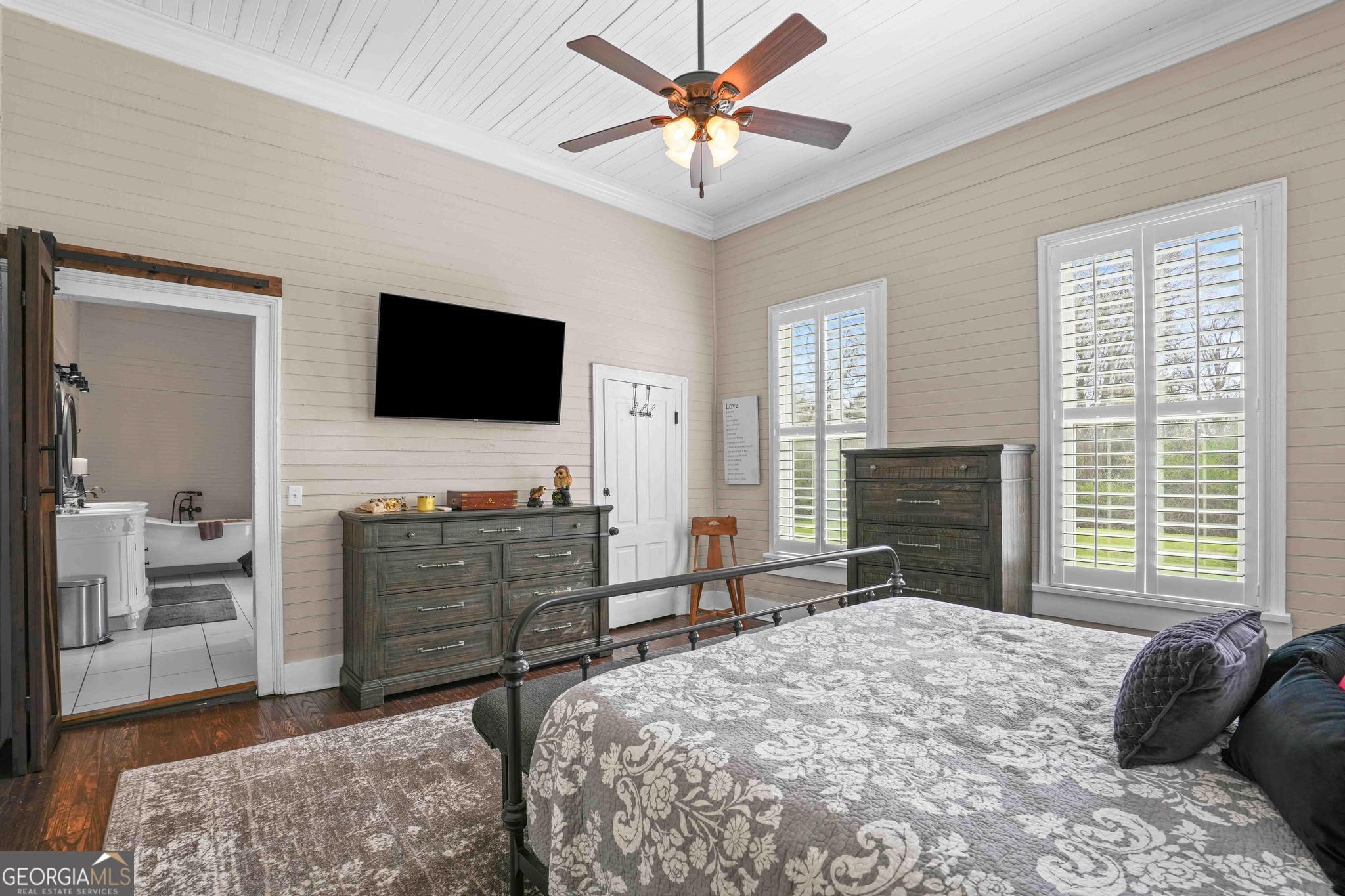 193 Bartee Road Woodbury, GA 30293 - Photo 41 of 84 a bedroom with a bed and a flat screen tv