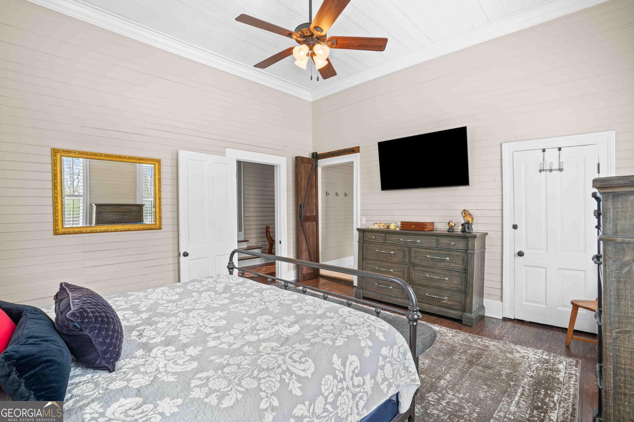 193 Bartee Road Woodbury, GA 30293 - Photo 42 of 84 a bedroom with a bed and a flat screen tv