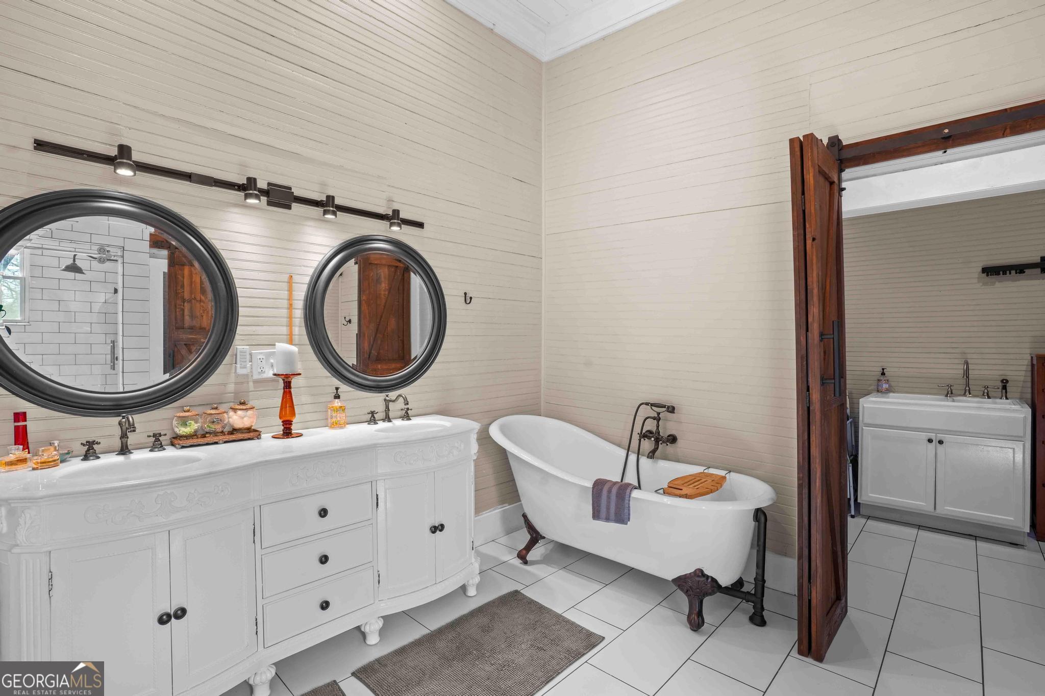 193 Bartee Road Woodbury, GA 30293 - Photo 46 of 84 a bathroom with a toilet a double vanity sink and a mirror