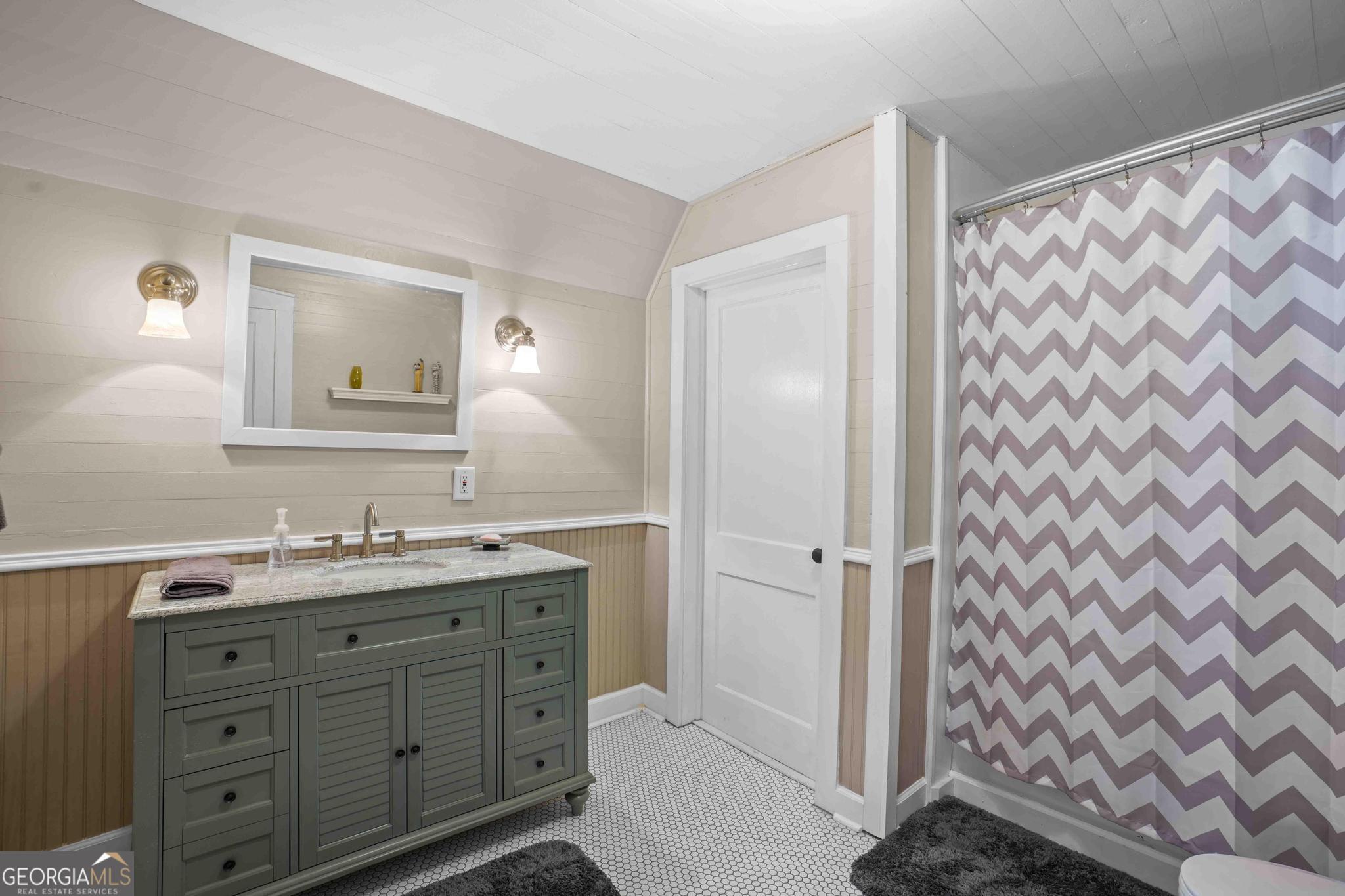 193 Bartee Road Woodbury, GA 30293 - Photo 58 of 84 a bathroom with a double vanity sink toilet mirror and shower