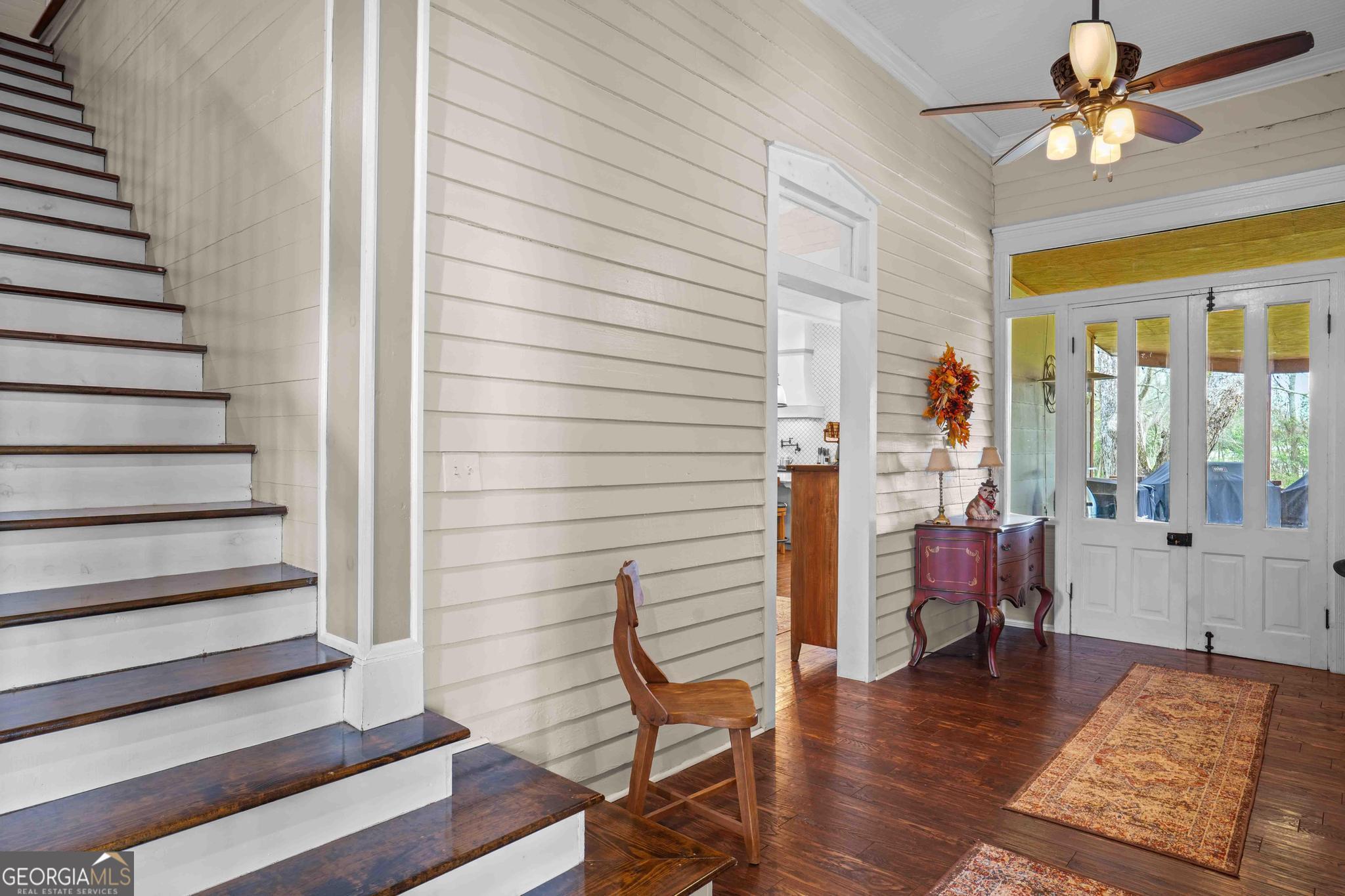 193 Bartee Road Woodbury, GA 30293 - Photo 59 of 84 a view of a livingroom with hardwood floor and a ceiling fan