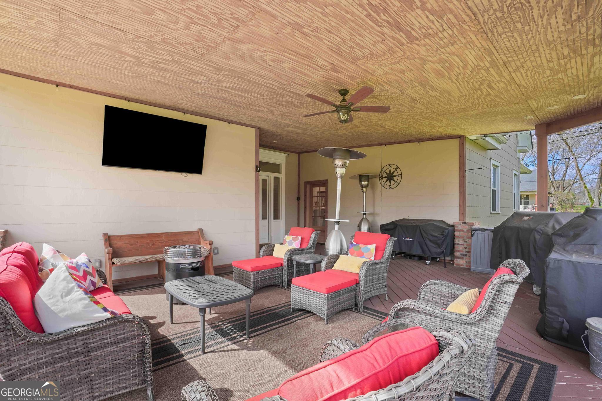 193 Bartee Road Woodbury, GA 30293 - Photo 62 of 84 a living room with furniture and a flat screen tv