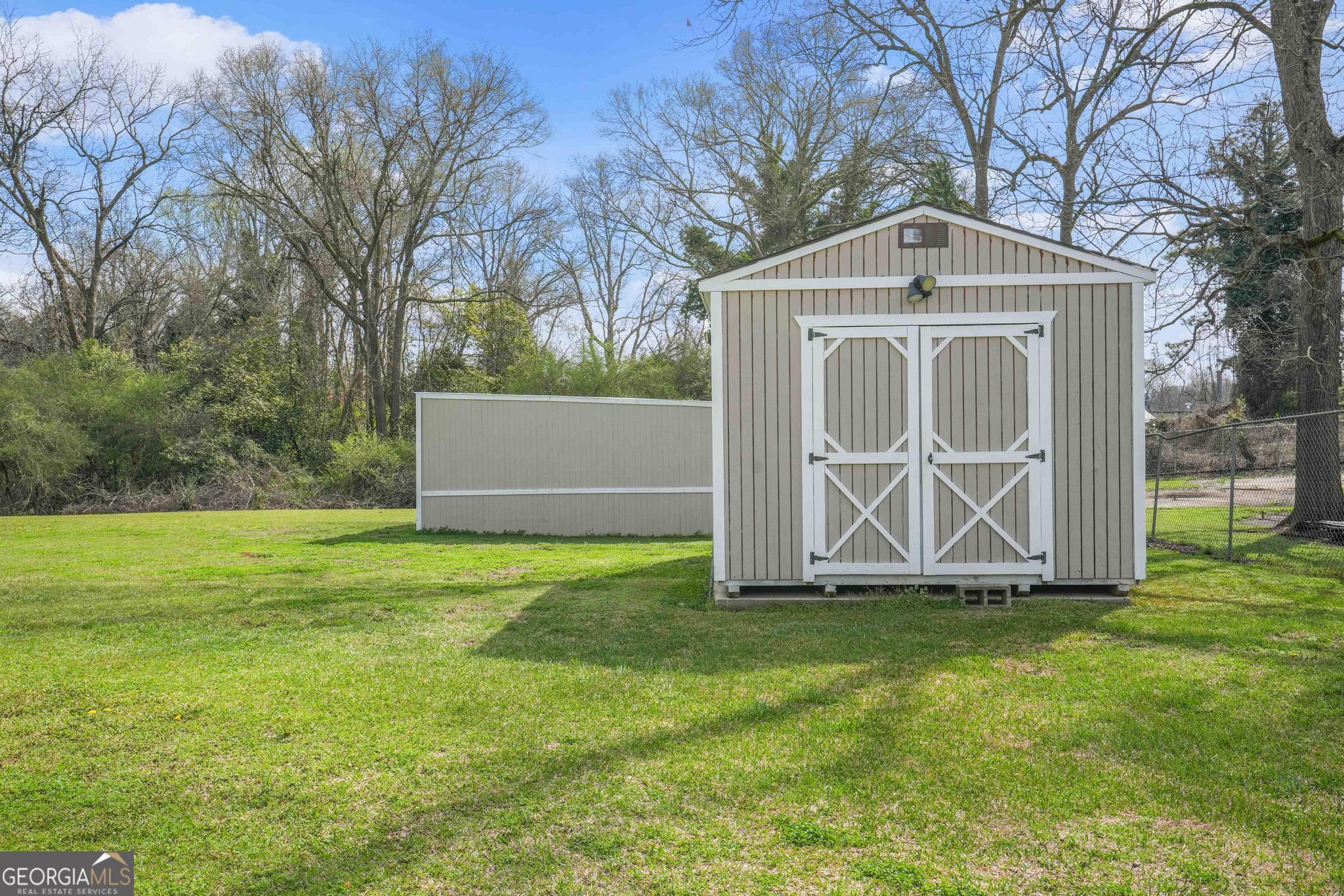 193 Bartee Road Woodbury, GA 30293 - Photo 65 of 84 a front view of house with yard and trees