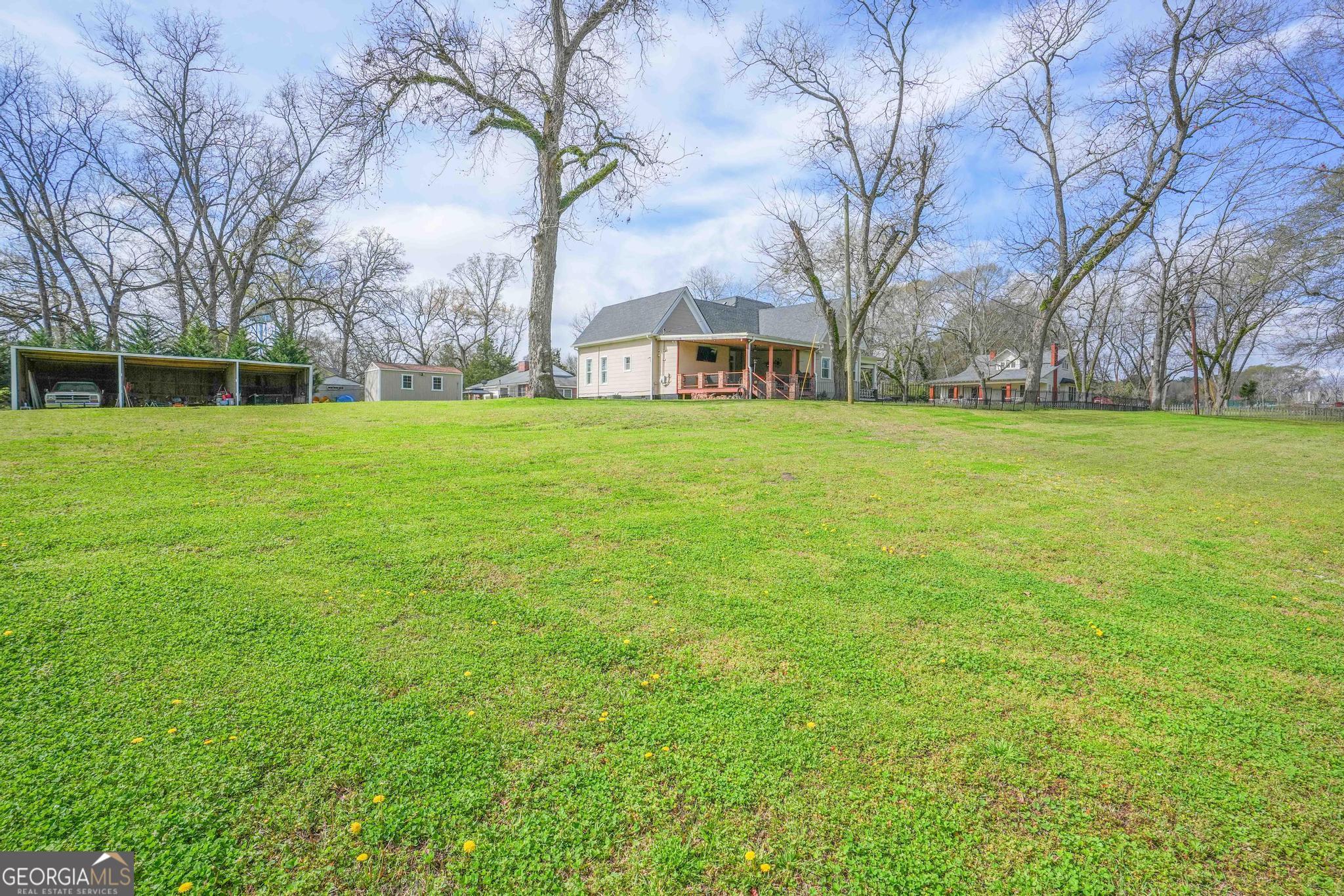 193 Bartee Road Woodbury, GA 30293 - Photo 69 of 84 a view of a large garden with plants and large trees