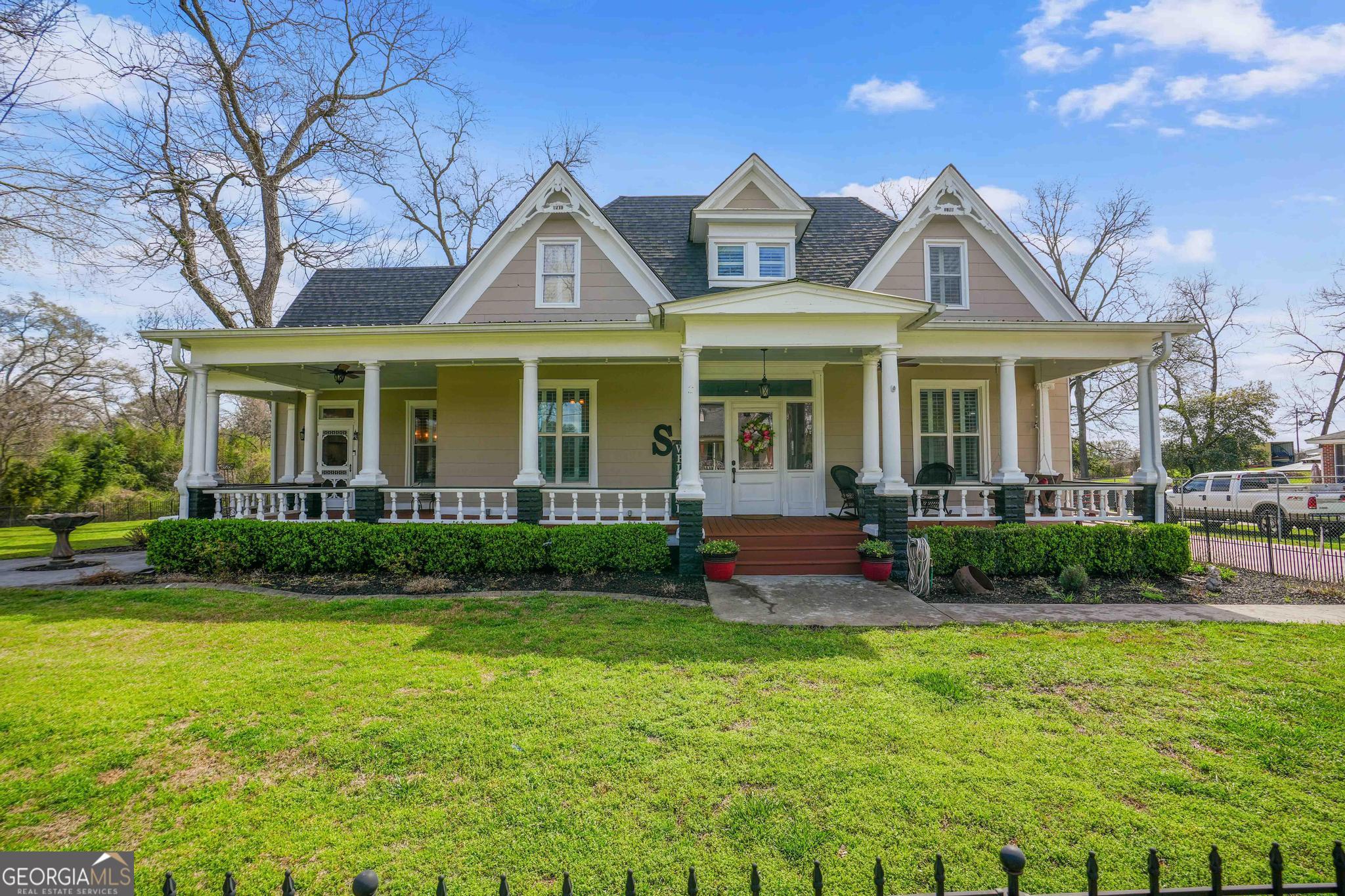 193 Bartee Road Woodbury, GA 30293 - Photo 71 of 84 a front view of a house with garden and porch