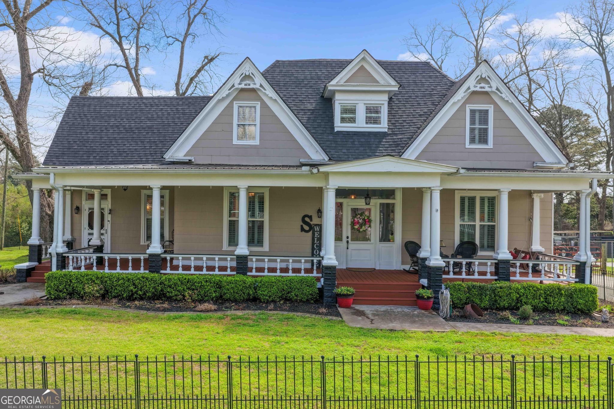 193 Bartee Road Woodbury, GA 30293 - Photo 72 of 84 a front view of a house with a yard table and chairs