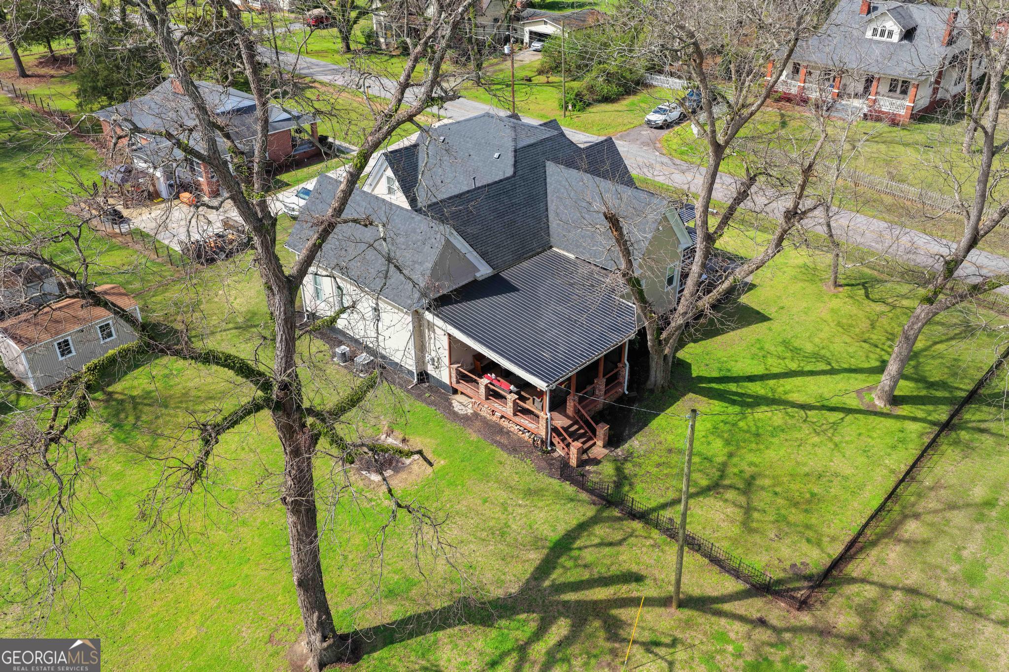 193 Bartee Road Woodbury, GA 30293 - Photo 76 of 84 a house with a yard and outdoor seating
